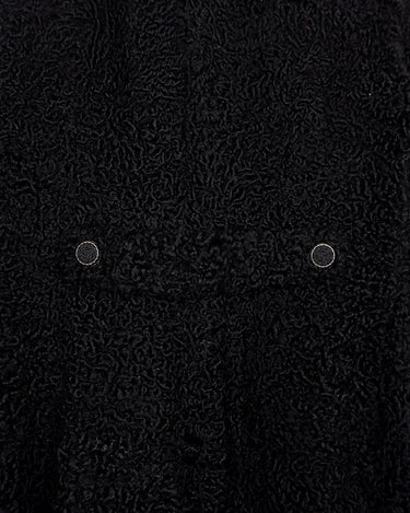 Wrap yourself in elegance with this vintage 80s 90s black real fur coat. This timeless piece adds a touch of luxury to any outfit.