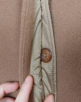 Get ready to slay the Y2k trend with this brown woolmix spring coat! Featuring a luxurious real fur collar, this coat is for everyone who loves to be elegant.