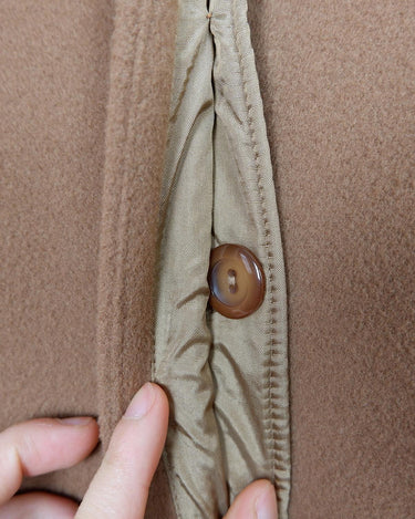Get ready to slay the Y2k trend with this brown woolmix spring coat! Featuring a luxurious real fur collar, this coat is for everyone who loves to be elegant.