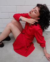Score a two-for-one with this red 90s vintage gem! A lightweight spring coat that totally transitions to a slick dress when you put on f.e some cycling shorts. Take your transitional looks to the next level!