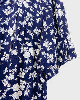 Dress to impress in this vintage 90s blue midi dress with a floral pattern! Tie it tighter for an S-M fit or let it go for a L-XL! Get yours now and get dressed to express!