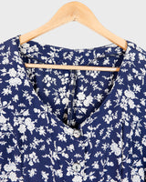 Dress to impress in this vintage 90s blue midi dress with a floral pattern! Tie it tighter for an S-M fit or let it go for a L-XL! Get yours now and get dressed to express!
