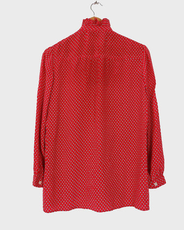 You can never go wrong with a classic! This Vintage 80s / 90s red blouse with the volant collar is as timeless as it gets. Lightweight and smooth, it's the perfect way to spruce up any outfit! Plus, what could be cuter than the unique pattern this blouse features? Get your hands on this timeless piece today!