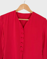 Score a two-for-one with this red 90s vintage gem! A lightweight spring coat that totally transitions to a slick dress when you put on f.e some cycling shorts. Take your transitional looks to the next level!