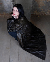 Who says vintage can't be wild? This coat is a bold and fierce statement piece! Don't settle for boring fashion - unleash your inner wild side with this unique and stylish leather coat!