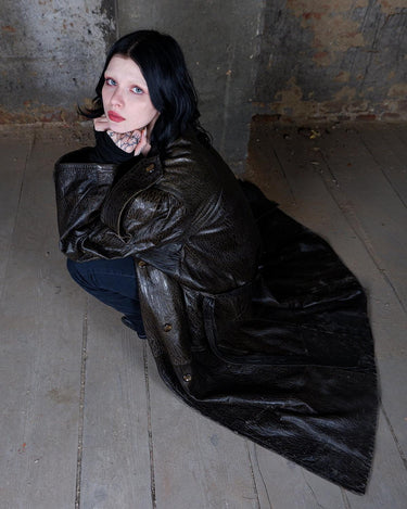 Who says vintage can't be wild? This coat is a bold and fierce statement piece! Don't settle for boring fashion - unleash your inner wild side with this unique and stylish leather coat!