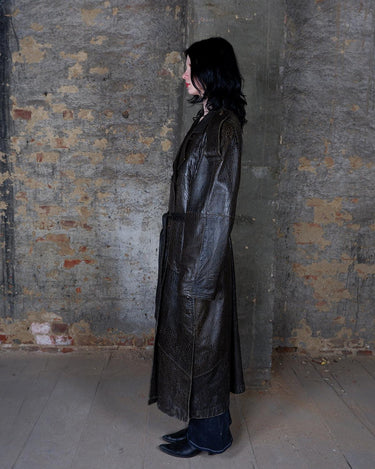 Who says vintage can't be wild? This coat is a bold and fierce statement piece! Don't settle for boring fashion - unleash your inner wild side with this unique and stylish leather coat!
