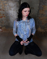 Revive the funky fashion of the 80s with our Vintage 80s 3/4 Sleeve Shirt. In blue with a colorful crazy pattern, it's also knitted with fine, soft fabric for comfort. Available in S-M. Get your groove on!