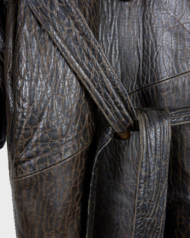 Who says vintage can't be wild? This coat is a bold and fierce statement piece! Don't settle for boring fashion - unleash your inner wild side with this unique and stylish leather coat!