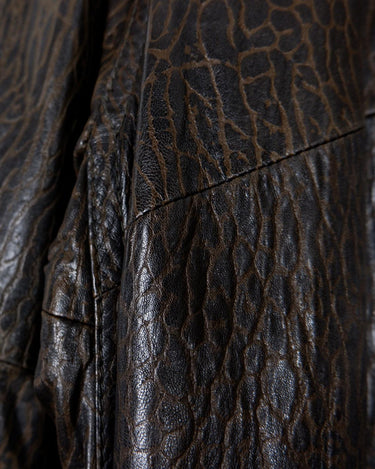 Who says vintage can't be wild? This coat is a bold and fierce statement piece! Don't settle for boring fashion - unleash your inner wild side with this unique and stylish leather coat!