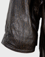 Who says vintage can't be wild? This coat is a bold and fierce statement piece! Don't settle for boring fashion - unleash your inner wild side with this unique and stylish leather coat!
