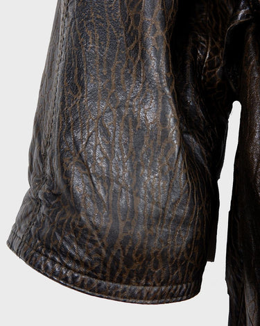 Who says vintage can't be wild? This coat is a bold and fierce statement piece! Don't settle for boring fashion - unleash your inner wild side with this unique and stylish leather coat!