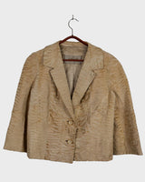Bring some serious sass to your wardrobe with this fab vintage blazer! Crafted from real fur and showcasing 70s 80s flair, this beige spring blazer is the perfect mix of elegance and playfulness.