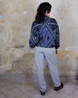 Get a laid back look with this vintage blue sweater from the 80s! Lightweight and perfect for spring, this sweater will add a pop of color to your wardrobe. It's perfect for a relaxed and effortless style.