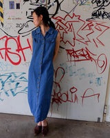 This vintage '90s denim maxi dress is a living legend! Its blue shade and back lacing detail is sure to give you an edge, so be ready to feel the spirit of it!