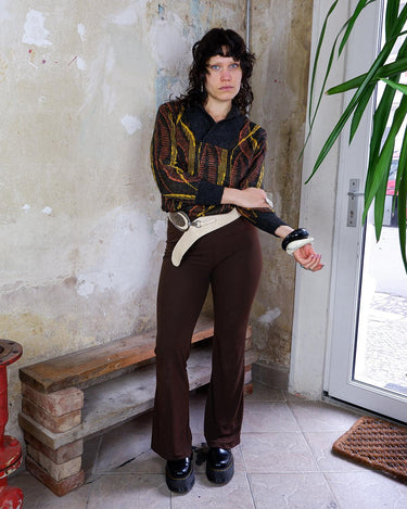 This vintage 80s sweater is a real trip! Featuring a wild yellow and orange psychadelic pattern, it will upgrade every basic outfit. This sweater is perfect for spring!
