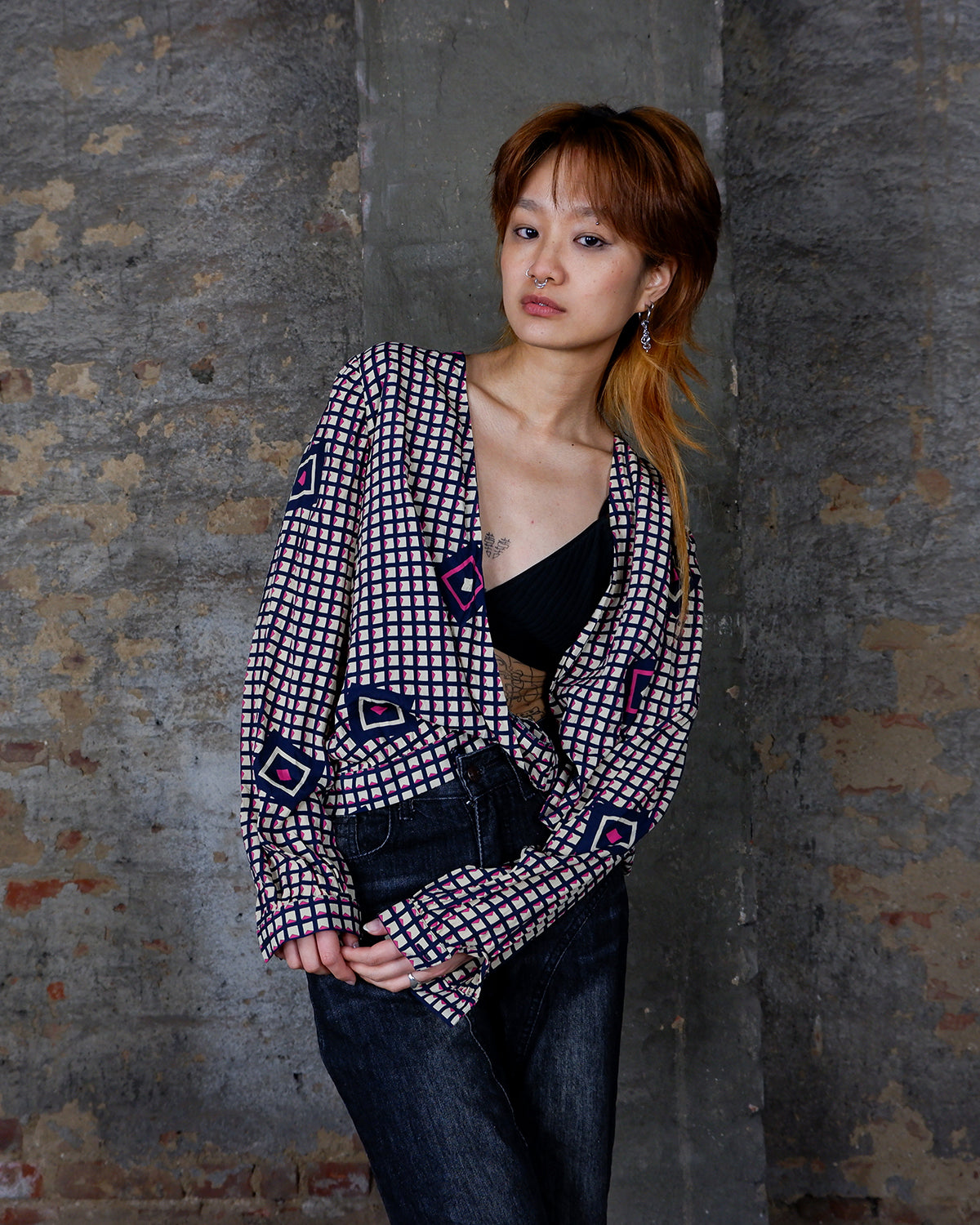 Say goodbye to boring blouses with this vintage 80s geometric masterpiece! Made from a luxurious silk mix, this blouse is a dream come true for those who love playful fashion.