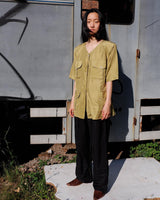 Who says shoulder pads are a thing of the past? Take a walk on the wild side and grab this vintage 80s golden (light greenish undertone) silk blouse with confidence!