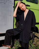 Revive 90s vintage flair with this black short sleeve summer blazer! Clothe yourself in minimalism design, featuring a long cut and super light fabric.