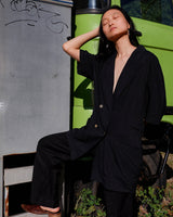 Revive 90s vintage flair with this black short sleeve summer blazer! Clothe yourself in minimalism design, featuring a long cut and super light fabric.