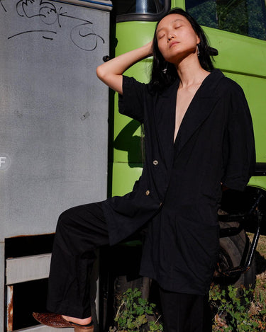 Revive 90s vintage flair with this black short sleeve summer blazer! Clothe yourself in minimalism design, featuring a long cut and super light fabric.