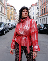 Add a touch of sparkle to your wardrobe with this premium vintage 80s red glitter lamb skin jacket (thin). The belted design offers a flattering fit, while the soft and supple leather provides luxurious comfort!