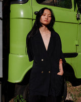 Revive 90s vintage flair with this black short sleeve summer blazer! Clothe yourself in minimalism design, featuring a long cut and super light fabric.