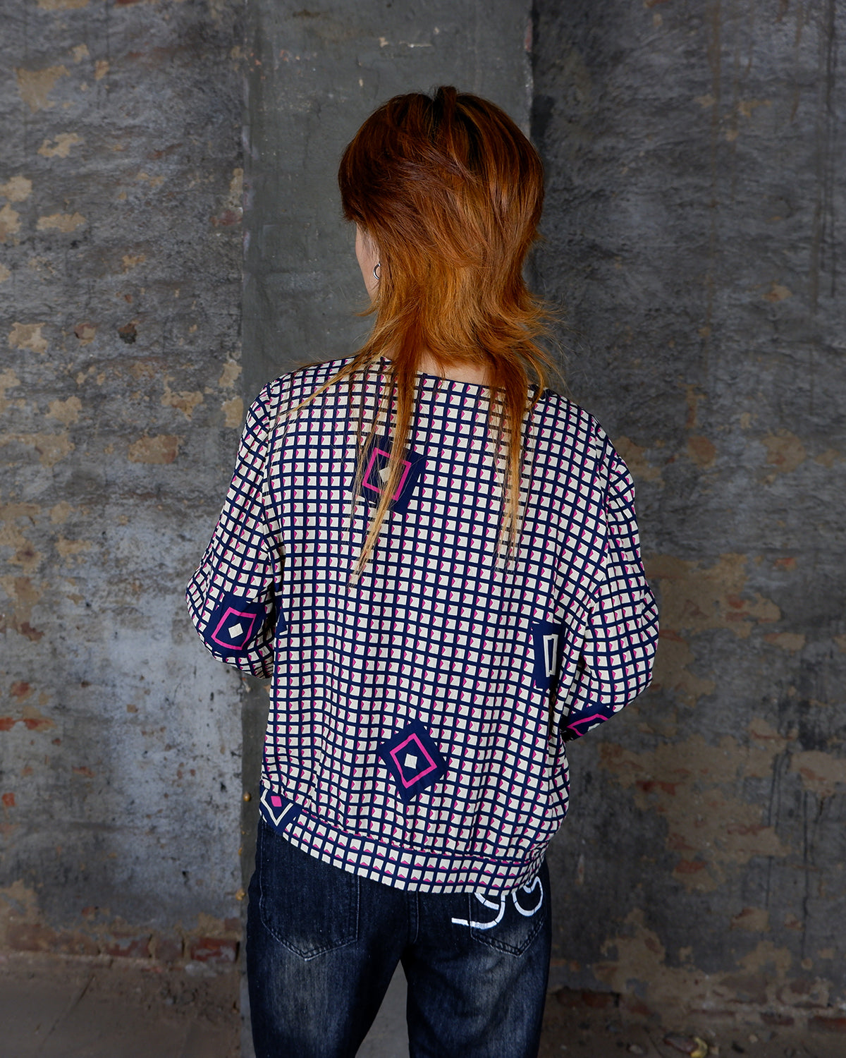 Say goodbye to boring blouses with this vintage 80s geometric masterpiece! Made from a luxurious silk mix, this blouse is a dream come true for those who love playful fashion.