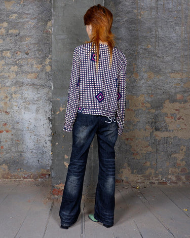 Say goodbye to boring blouses with this vintage 80s geometric masterpiece! Made from a luxurious silk mix, this blouse is a dream come true for those who love playful fashion.
