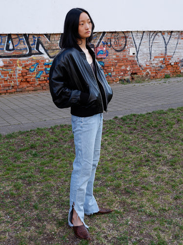This iconic Vintage 80s black bomber leather jacket brings the edge with a serious dose of attitude! Boasting shoulder pads and a classic bomber jacket silhouette, it's sure to unleash your inner wild child!