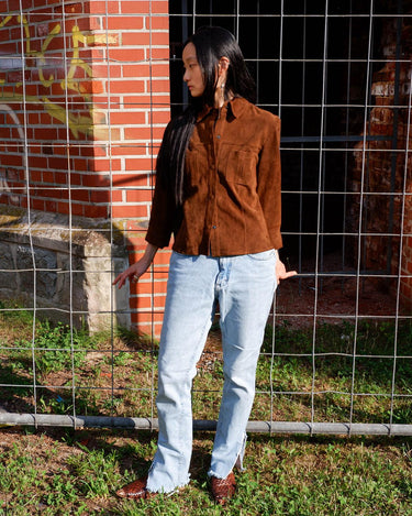 Experience the smoothness with this Vintage 90s classy brown faux suede leather shirt! Carefully crafted with velvety soft faux suede leather fabric, this piece adds a timeless touch of the 90s to any outfit. The press studs complete the look, making you a true smooth operator!