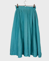 This is love at first sight. You'll fall for this vintage midi silk skirt in dreamy turquoise / light blue shading! Perfectly sized for XS. Please keep in mind that this skirt has some flaws such as rubbed material spot (last photo).