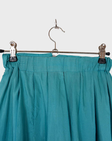 This is love at first sight. You'll fall for this vintage midi silk skirt in dreamy turquoise / light blue shading! Perfectly sized for XS. Please keep in mind that this skirt has some flaws such as rubbed material spot (last photo).