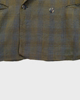 Step into spring with this vintage 80s olive green linen mix blazer, complete with shoulder pads and a grandpastyle washed out tartan/checkered pattern. This blazer is perfect for spring or summer nights with its thin fabric!