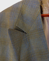 Step into spring with this vintage 80s olive green linen mix blazer, complete with shoulder pads and a grandpastyle washed out tartan/checkered pattern. This blazer is perfect for spring or summer nights with its thin fabric!
