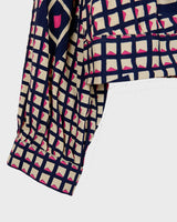 Say goodbye to boring blouses with this vintage 80s geometric masterpiece! Made from a luxurious silk mix, this blouse is a dream come true for those who love playful fashion.