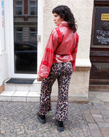 Add a touch of sparkle to your wardrobe with this premium vintage 80s red glitter lamb skin jacket (thin). The belted design offers a flattering fit, while the soft and supple leather provides luxurious comfort!