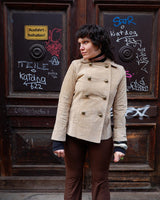 Introducing the y2k beige/cream brown Dino'z leather jacket! Complete with dark golden buttons and light shoulder pads, this jacket is just timeless! 