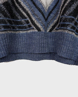 Get a laid back look with this vintage blue sweater from the 80s! Lightweight and perfect for spring, this sweater will add a pop of color to your wardrobe. It's perfect for a relaxed and effortless style.