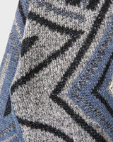 Get a laid back look with this vintage blue sweater from the 80s! Lightweight and perfect for spring, this sweater will add a pop of color to your wardrobe. It's perfect for a relaxed and effortless style.