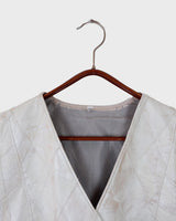 Ready for this 80s 90s vintage white diamond pattern leather vest? The light shimmer adds an an extra sparkle to any outfit.