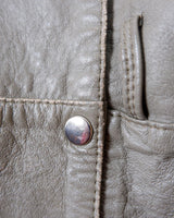 This Vintage 80s grey two row button leather jacket (thin material so perfect for spring) with its light brown undertone is a true timeless piece. From the two row button design to the leather material, this jacket is the perfect piece to embrace the classic look.