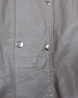 This Vintage 80s grey two row button leather jacket (thin material so perfect for spring) with its light brown undertone is a true timeless piece. From the two row button design to the leather material, this jacket is the perfect piece to embrace the classic look.