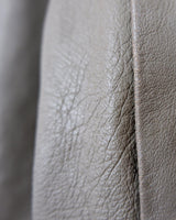 This Vintage 80s grey two row button leather jacket (thin material so perfect for spring) with its light brown undertone is a true timeless piece. From the two row button design to the leather material, this jacket is the perfect piece to embrace the classic look.