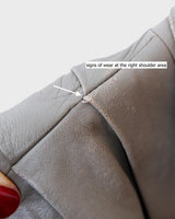 This Vintage 80s grey two row button leather jacket (thin material so perfect for spring) with its light brown undertone is a true timeless piece. From the two row button design to the leather material, this jacket is the perfect piece to embrace the classic look.
