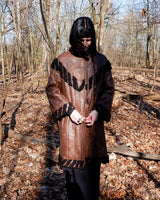 Looking for a statement piece? Look no further! This Vintage 80s brown leather coat with black real fur is a versatile addition to any wardrobe. Its unique design and edgy style make it perfect for you!