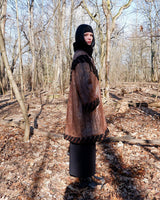 Looking for a statement piece? Look no further! This Vintage 80s brown leather coat with black real fur is a versatile addition to any wardrobe. Its unique design and edgy style make it perfect for you!