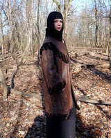 Looking for a statement piece? Look no further! This Vintage 80s brown leather coat with black real fur is a versatile addition to any wardrobe. Its unique design and edgy style make it perfect for you!
