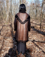 Looking for a statement piece? Look no further! This Vintage 80s brown leather coat with black real fur is a versatile addition to any wardrobe. Its unique design and edgy style make it perfect for you!
