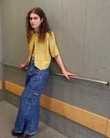 This Vintage 80s yellow short sleeve blouse is a double dose of 80s with its two rows of buttons and shoulder pads!